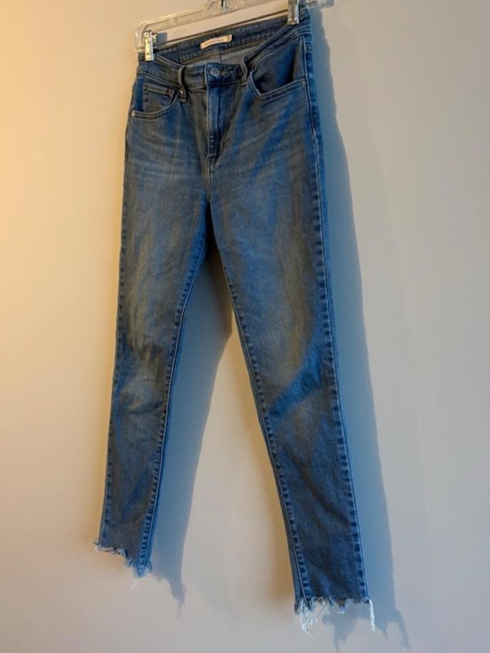 Levi's Women's Skinny Jeans in Medium Blue with Frayed Hem